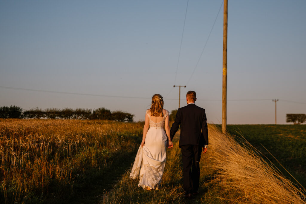 Newly Wed Couple Walking Outside | Unique Norfolk Venues
